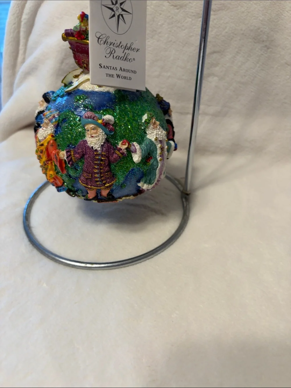 Christopher Radko Santa’s around the world with tag